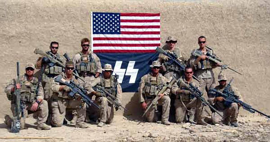 US Marines pose in front of SS flag